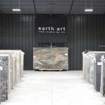 slabs of granite under earth art banner