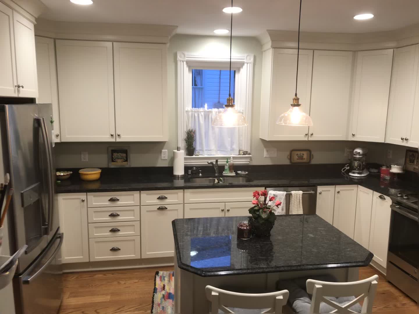 kitchen with black counters and beige cabinets